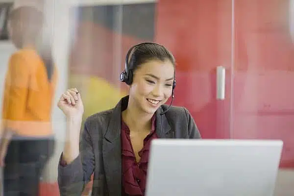 A smiling female, Philippines customer service representative provides Philippines customer service outsourcing solutions to a customer who would like to return their purchased product for a replacement.