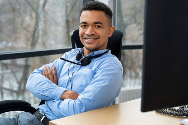 This picture shows a handsome customer service rep from a leading call center in Honduras - a prominent LATAM outsourcing hub; the agent demonstrates the positive energy he exerts while providing stellar customer service support that brings long-term LATAM-based business growth & success.